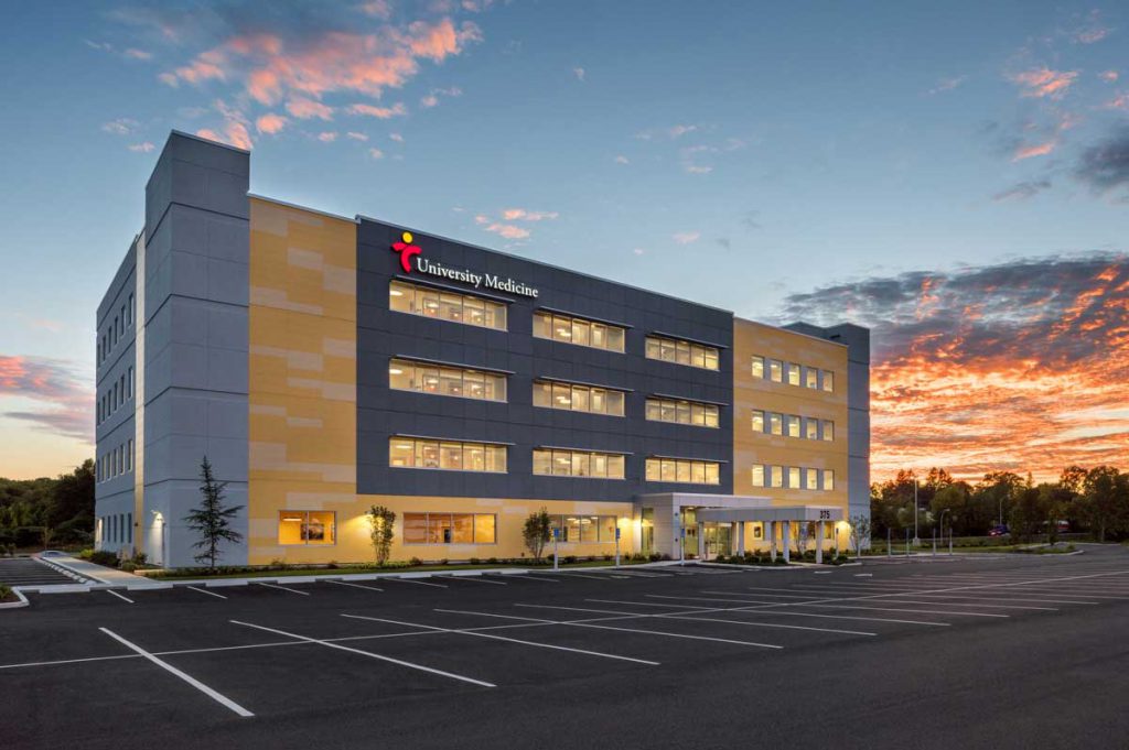 university medicine medical office building exterior at dusk